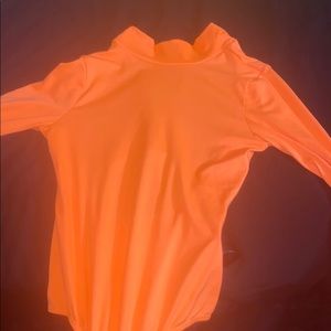 Orange Open back bodysuit from FashionNova